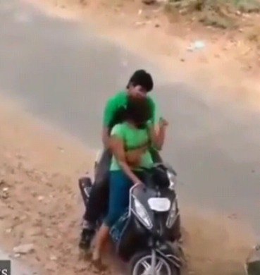 outdoor young couple on scooty